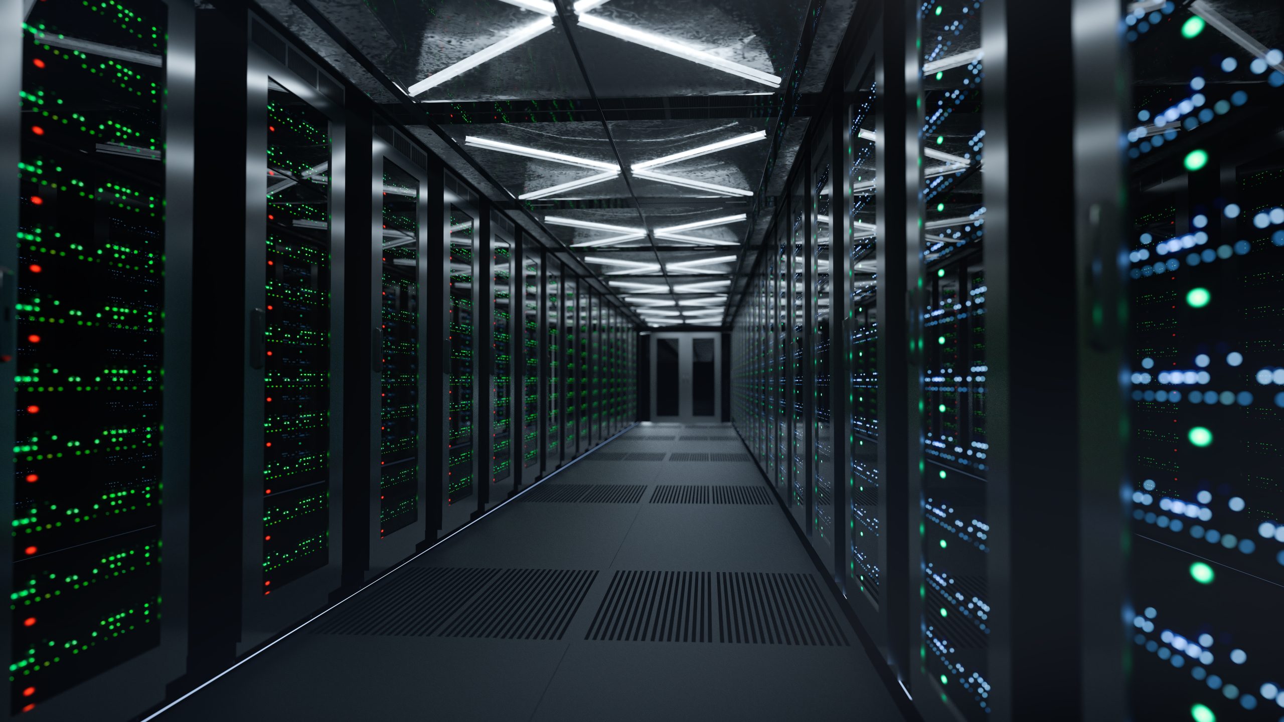 Data center aisle with racks of servers and blinking green/blue LEDs.